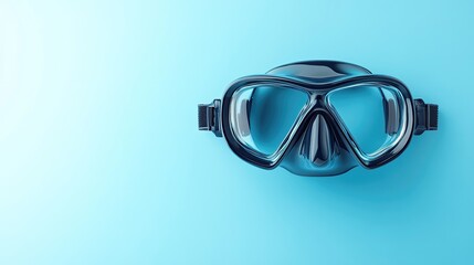 A black diving mask with clear lenses sits on a light blue background.