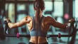 © Napasnan - Person using a rowing machine, with focus on the back muscles and the rhythm of the workout