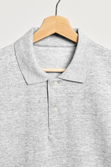 Sticker - Gray men's collared shirt on a wooden hanger