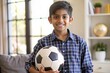 © N7 - Indian Boy with Football - An Indian boy posing with a football, representing his love for sports.
