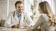 © Photo_hub - Smiling male doctor in a white coat discussing health with a young female patient in a bright office