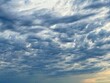 © waupee - Clouds in the sky just before sunset. Clouds and blue sky