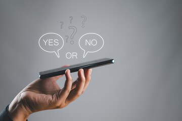 Wall Mural - think with yes or no 2 option concept. business choices for difficult situations. man's hand holding