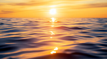 calm ocean surface bathed in the golden light of a beautiful sunset