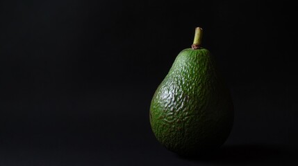 Wall Mural - Fresh Avocado on Dark Background