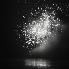 Poster - Abstract black and white image of a sparkling explosion with a reflection in the water.