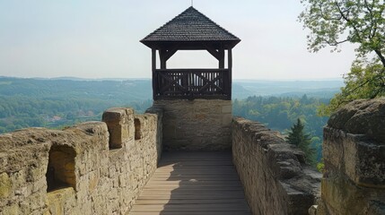 Wall Mural - A historical watchtower with a wooden platform and protective walls, offering a panoramic view of the surrounding landscape