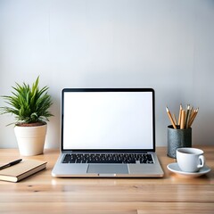 Wall Mural - Clean and minimalist workspace with a laptop. a cup of coffee. and a potted plant.