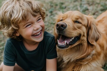 Wall Mural - A young child and a golden retriever are both smiling while sitting in a backyard. The golden retriever's joy reflects the happiness and bond they share together.