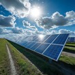 © PuiZera - Solar panels in a field on a sunny day with blue skies and clouds.
