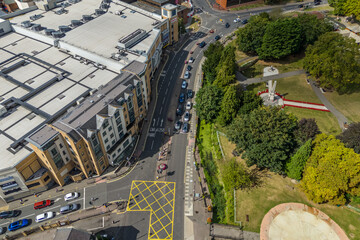 Aerial drone shot over cars driving on the road in Bishops Stortford in England