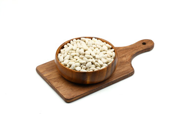 white kidney bean in wooden bowl isolated on white background. Top view. Flat lay