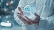 © VK Studio - A medical professional in a sterile environment holds a holographic globe, representing global healthcare innovation and digital connectivity.