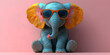 © VertigoAI - A cute cartoon baby elephant wearing sunglasses sits on a pink background.