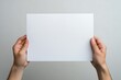 © Rama - Man with hands holding blank paper for presentation