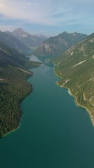 Wall Mural - Breathtaking aerial shot of Lake Plansee in Tyrol, Austria, showcasing stunning nature and crystal-clear waters.