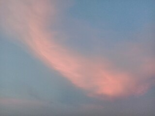 A clear blue sky with a few clouds. The sky is so clear that it almost looks like a painting