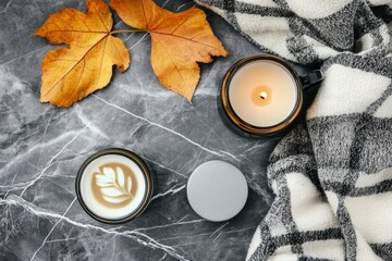 An autumnal composition with coffee, plaid, and autumn leaves on a black background. Flat lay, top view, copy space.