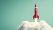 © Keattipoom - Futuristic Innovation Concept - Red Rocket Soaring on Fluffy Cloud Symbolizing Achievement and Success in Light Green Sky Background