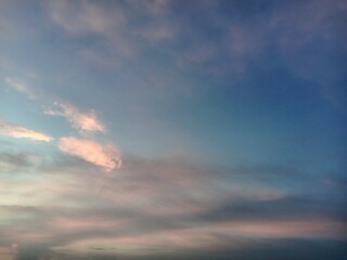 A clear blue sky with a few clouds. The sky is so clear that it almost looks like a painting