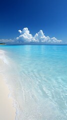 Wall Mural - Tranquil blue sea with white sandy beach and fluffy clouds.