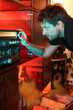 © Luciano Spinelli/Stocksy - Musician play one of his vinyl record collection songs at home