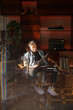 © Luciano Spinelli/Stocksy - Musician reading the name of the songs in the back of a vinyl record