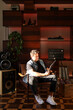 © Luciano Spinelli/Stocksy - Portrait of man lighted by the sun in his vintage fat looking record