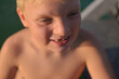 © Anna Malgina/Stocksy - A 6 years old  smiling kid on a lake
