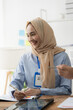 © Kritdanai - Focused Muslim Businesswoman in Collaboration