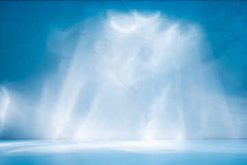 Wall Mural - Abstract light blue background for product presentation. Light and shadow on plaster wall.	
