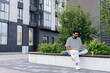 © Oleksii Syrotkin/Stocksy - Calm focused web developer working on laptop outdoors