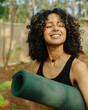 © Satya Gautam/Stocksy - A  yoga practitioner woman smiling to the sun