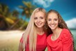 © BillionPhotos.com - Portrait of happy female friends on the beach