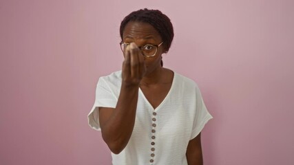 Wall Mural - Young african american woman wearing glasses and confidently making italian gesture with hand and fingers over isolated pink background