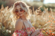 © Stopho Luv - In radiant glow of a sunny summer morning, a wide-angle view captures stunning outdoor portrait of a beautiful, elegant blond woman with perfect wavy hair, exuding confidence as she holds a luxurious