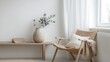 © HideAwayDigitalTH - A cozy minimalist living space featuring a wooden chair, decorative vase, and warm natural light.