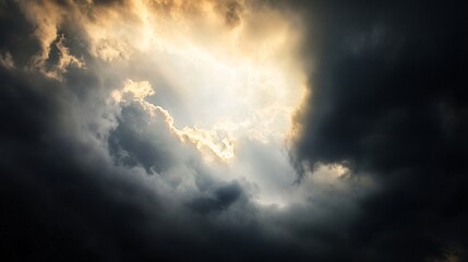 dark clouds with the sun breaking through, stormy weather, dramatic lighting