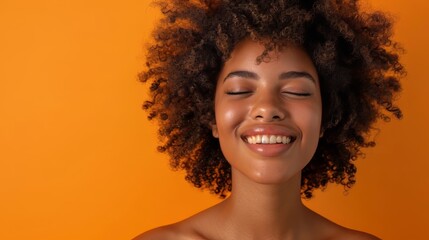 an afro woman with natural curly hair, smiling softly