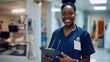 © CreativeSeven  - Smiling Nurse in Hospital Corridor Holding Clipboard and Wearing Stethoscope