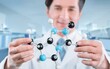© BillionPhotos.com - Scientist holding molecular model in laboratory