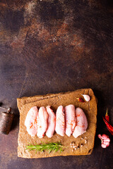 Canvas Print - Raw chicken wings with ingredients for cooking