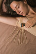 © Alina Hvostikova/Stocksy - Woman Shaving With Spaghetti