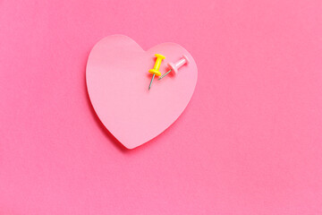 Wall Mural - Paper note in shape of heart with pins on pink background