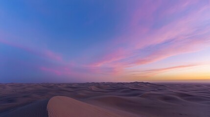 Poster -  A picturesque desert scene with rolling sand dunes beneath a sky blending pink and blue hues, framed by a stunning sunset