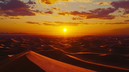 Wall Mural -  Sun setting on desert dunes with cloudy background