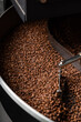 © Momento Estudio/Stocksy - coffee roaster detail