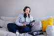 © Oleksii Syrotkin/Stocksy - Plus size podcaster reading notes on smartphone during live streaming