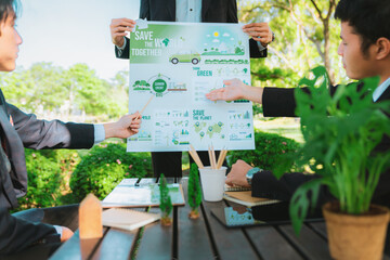 Wall Mural - Group of asian business people presenting environmentally friendly development plan and sustainable technology project for greener future, establishing outdoor eco business office at natural park.Gyre