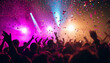 © vanAmsen - A dynamic, vibrant scene of a concert crowd dancing and celebrating under a dazzling display